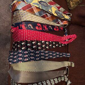 Collection of Men's ties, everyday, Christmas, and Lobster fun ties.